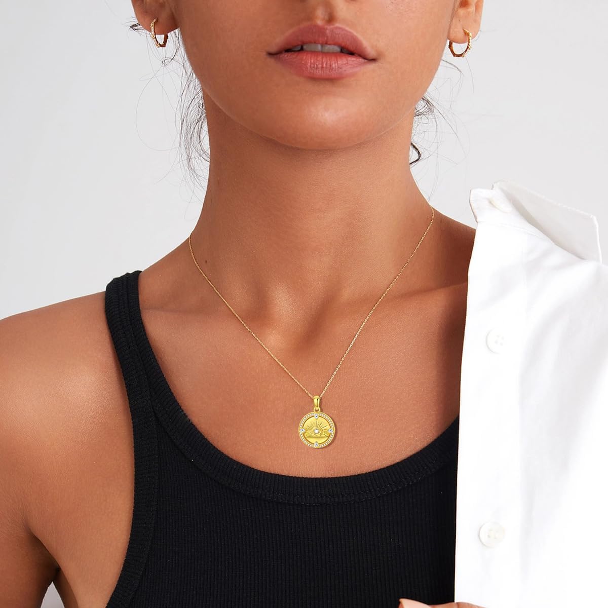 The Charm Behind the Mountain Coin NecklaceAt its core, the Mountain Coin Necklace is inspired by the raw, majestic beauty of nature. The sun rising over the mountains symbolizes new beginnings, ambition, strength, and inner peace. When you wear this pendant, you carry a piece of that symbolism close to your heart. A Perfect Fusion of Art and Nature This necklace blends elegant design with symbolic depth: Mountain Motif: Represents grounding, endurance, and exploration. Sun Accent: Reflects vitality, hope, and joy. Zircon Inlay: Adds a sparkling touch that complements the 14K gold-plated coin. Each piece is meticulously crafted to reflect harmony between elegance and the wild spirit of the outdoors. Material and Craftsmanship: Where Luxury Meets Durability What sets this necklace apart is the high-quality material used in its creation. It's made from 925 sterling silver and plated with 14K gold, ensuring both luxury and long-lasting durability.